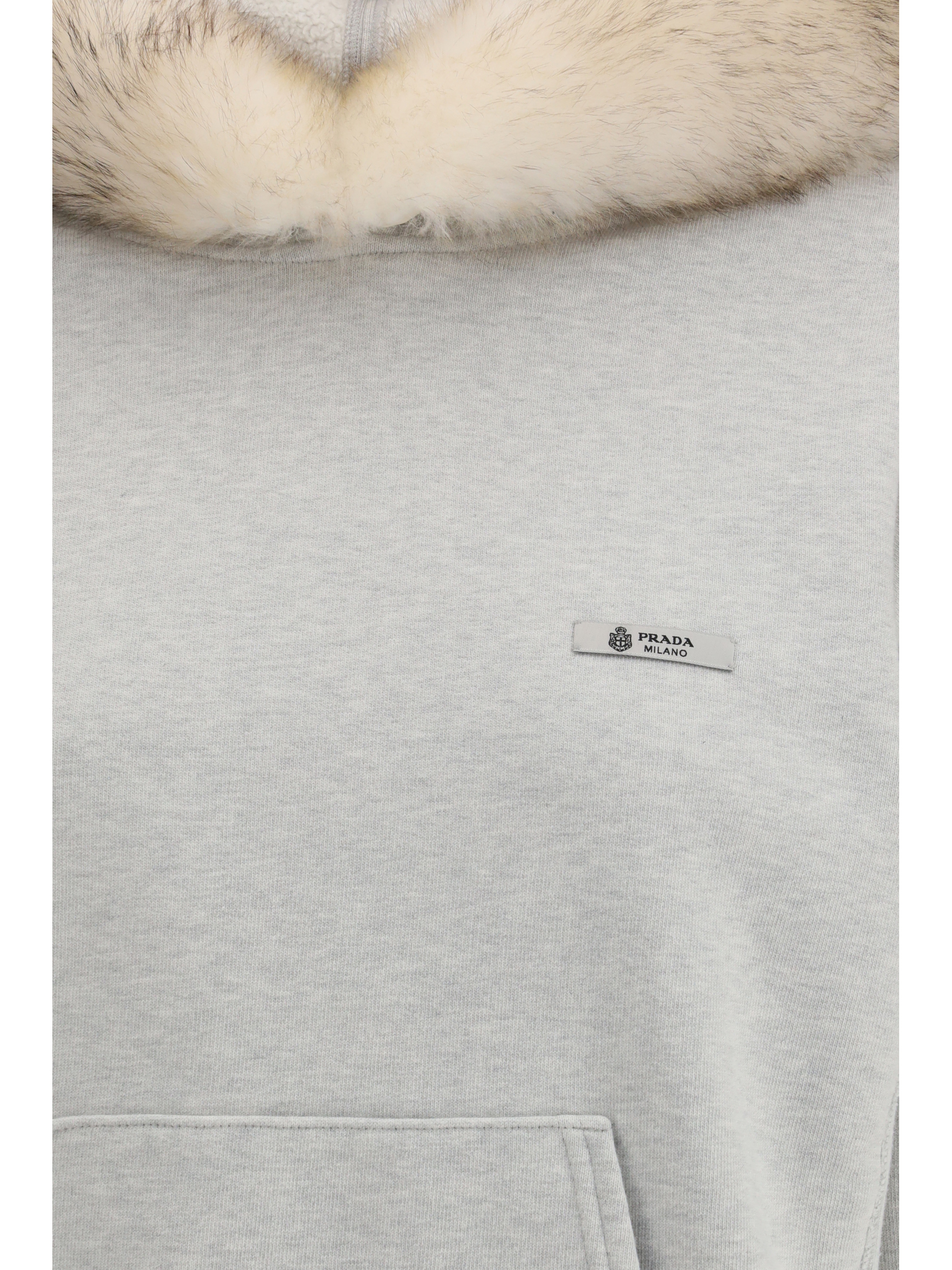 Hoodie features a hood lined in shearling