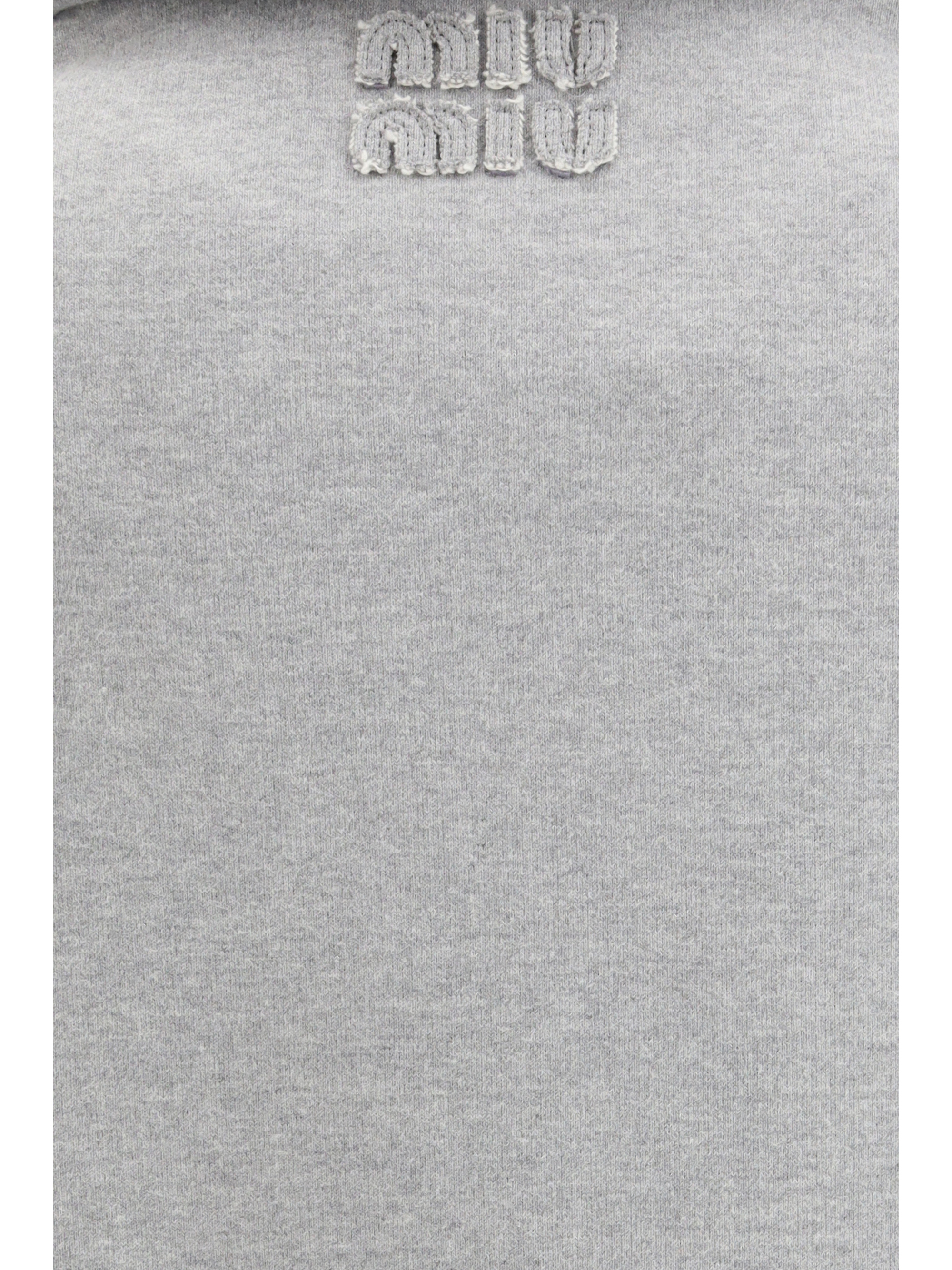 Sweatshirt with oblique zip closure