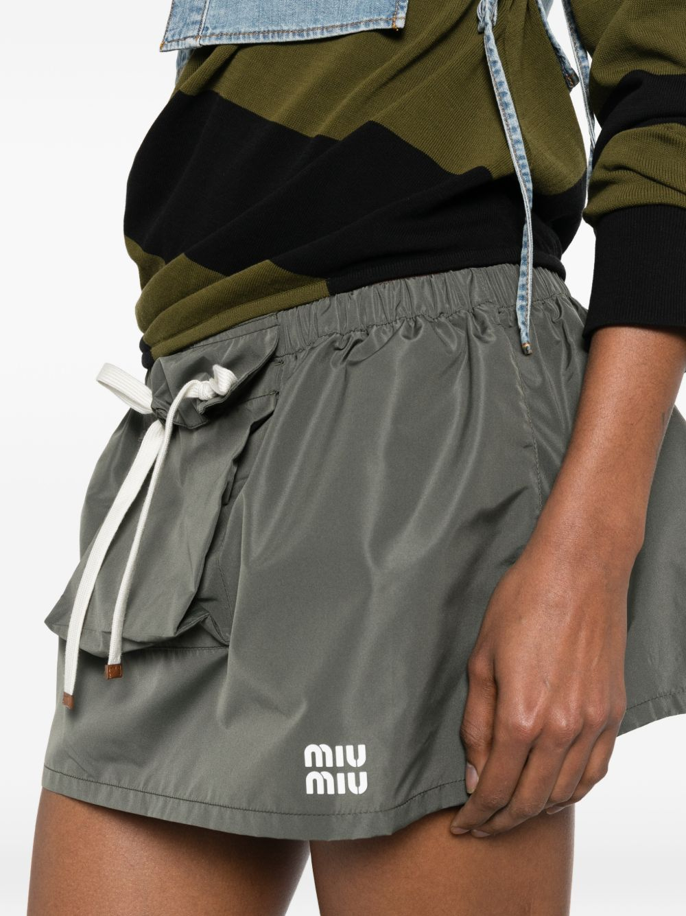 [Miu Miu] Mini skirt FW26 MG2704121IF0414